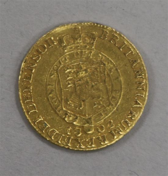 A George III gold half guinea, 1802, 4g, NF